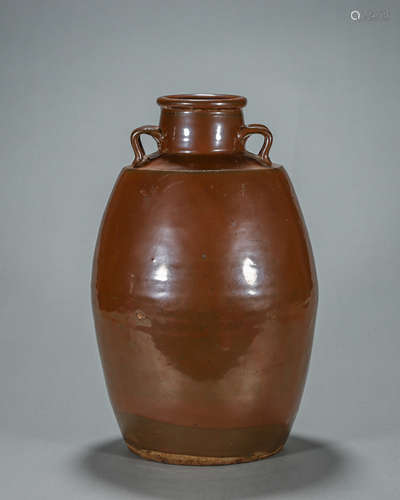 A brown glazed porcelain pot