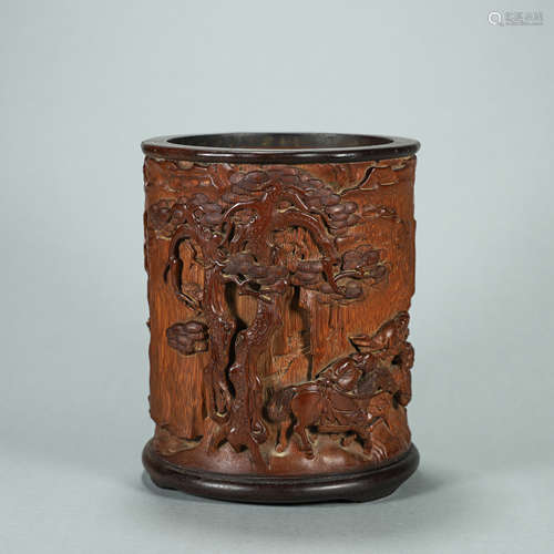 A carved bamboo brush pot