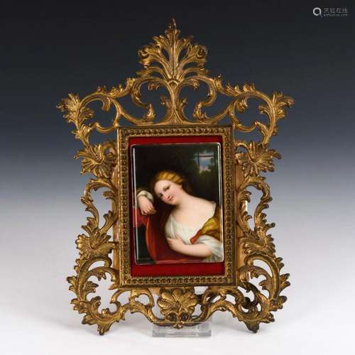 PORCELAIN PLAQUE WITH PORTRAIT OF A LADY IN BRONZE FRAME.