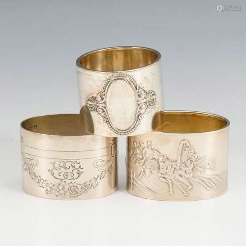 3 SILVER NAPKIN RINGS.