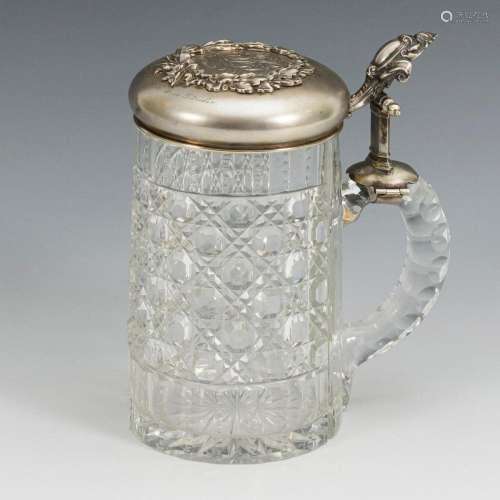 GLASS JUG WITH SILVER LID.