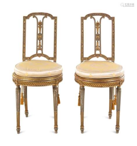 A Pair of Louis XVI Style Painted and Parcel Gilt Side Chair...
