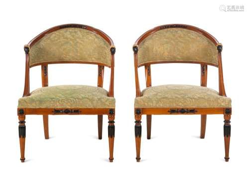 A Pair of Empire Style Parcel Gilt and Ebonized Bergeres
