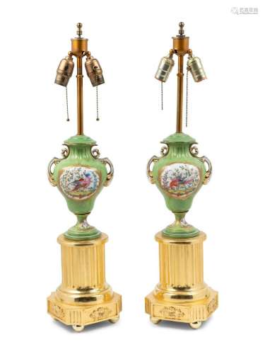A Pair of Sevres Style Porcelain and Giltwood Urns Mounted a...