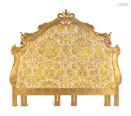 A Giltwood Headboard with Fortuny Upholstery