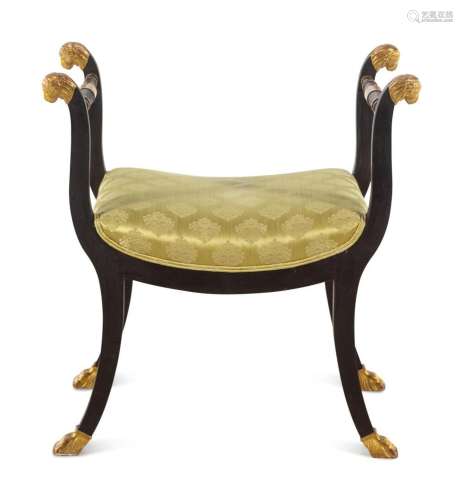 An Italian Parcel Gilt and Ebonized Curule Bench