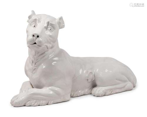 An Italian Painted Terra Cotta Figure of a Recumbent Dog