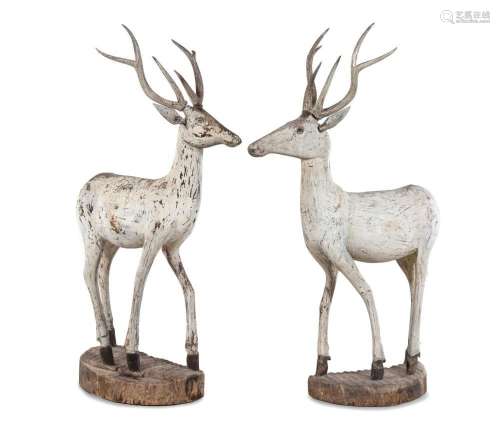 A Pair of Carved and Painted Figures of Deer