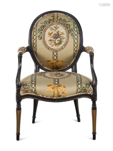 A George III Style Parcel Gilt and Ebonized Armchair