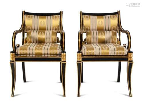 A Pair of Regency Style Parcel Gilt and Ebonized Armchairs