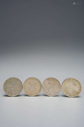 A set of 4 silver coins