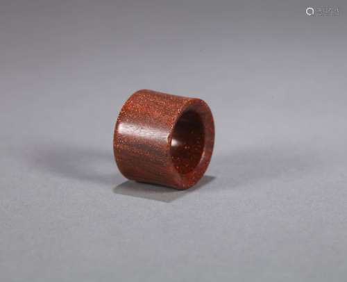 A red sandalwood thumb ring