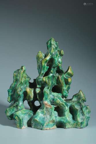 A green glazed porcelain rockery ornament