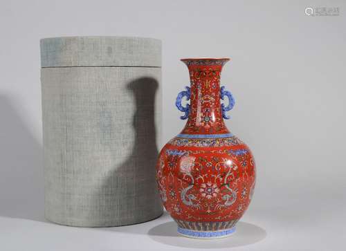 An iron red ground dragon and flower porcelain vase with ori...