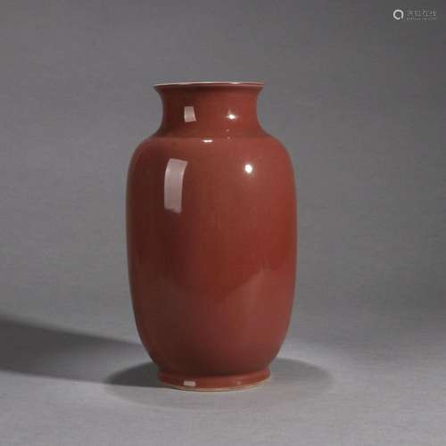 A red glazed porcelain lantern shaped vase