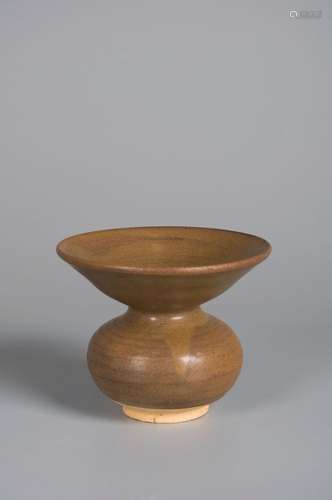 A brown glazed porcelain vessel