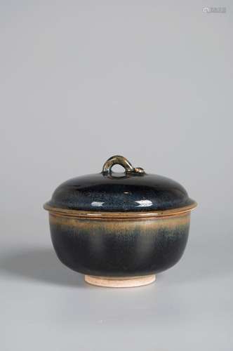 A black glazed porcelain covered jar