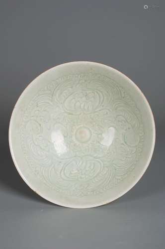 A flower carved celadon porcelain bowl