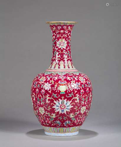 A red ground famille rose lotus porcelain vase