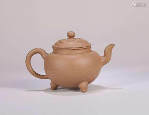 A three-legged zisha ceramic pot