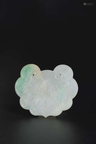 A peony carved jadeite pendant