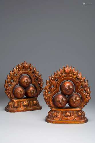 A pair of lacquered wood talismans