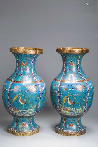 A pair of bird and flower enamel vases