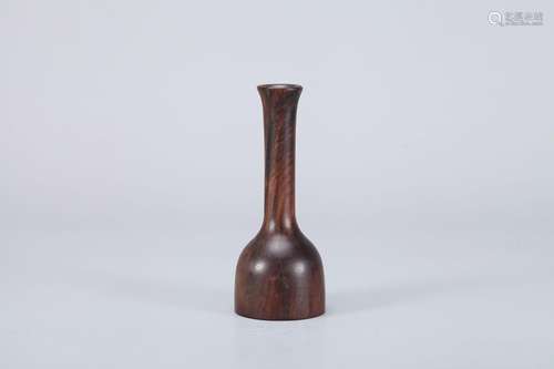 A red sandalwood flower holder