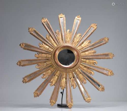 Large sun mirror in gilded wood
