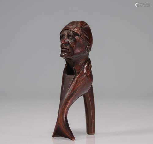 Carved wooden nutcracker with a man s head