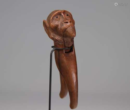 Carved wooden nutcracker with monkey head