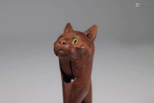 Carved wooden nutcracker with cat s head. Glass eyes