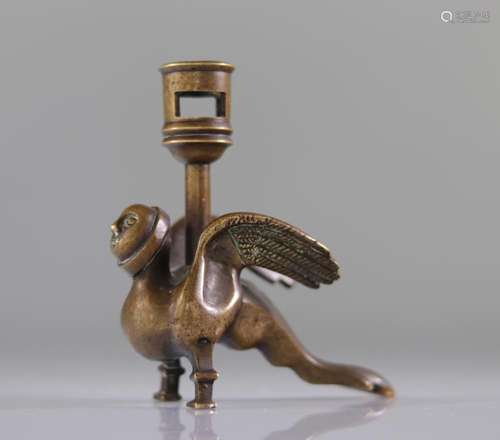 Exceptional 12th century bronze candlestick in the shape of ...