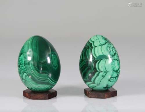 Malachite eggs resting on ebony bases