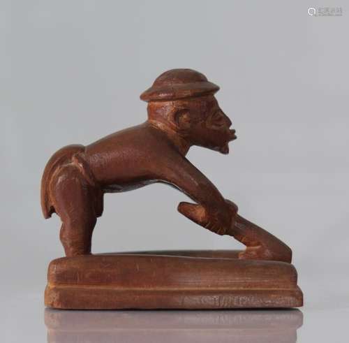 Carved Congo sculpture of a settler