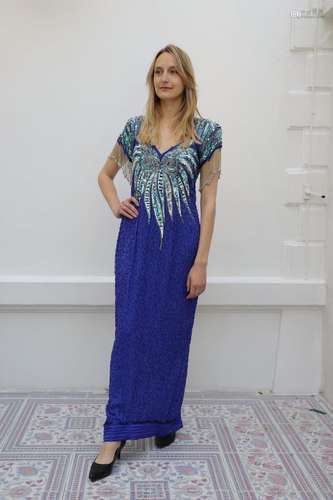 Robe de scène bleue<br />
Nombreux sequins et manches à fran...