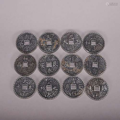 TWEELVE CHINESE SILVER COINS