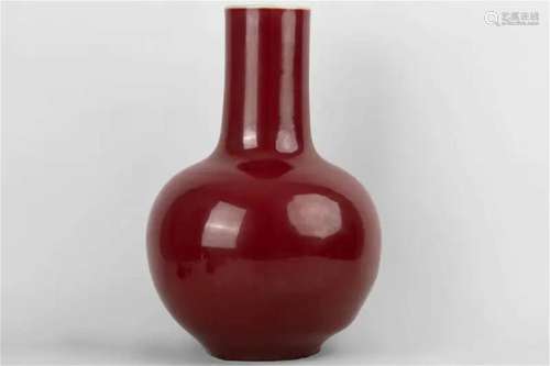 A red-glazed celestial ball vase with 'Yongzheng Nian Zh...