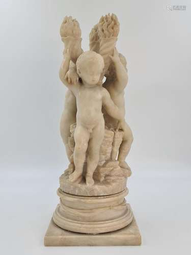 Sculpture en albâtre représentant une ronde de trois putti a...