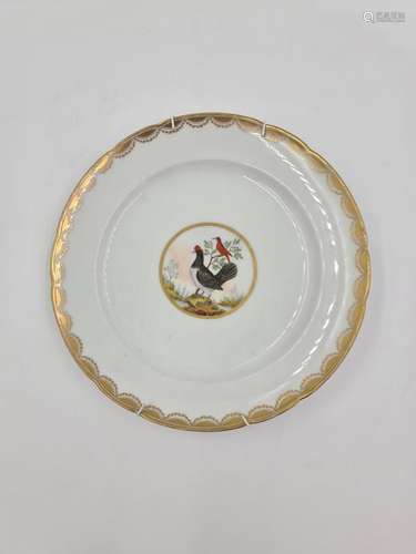 Assiette en porcelaine fin XVIIIème à décor polychrome d'...