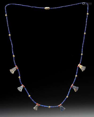 AN EGYPTIAN LOTUS FLOWER LAPIS LAZULI AMULET NECKLACE, CIRCA...