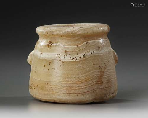 AN EGYPTIAN TRAVERTINE TWO-HANDLED JAR, CIRCA 1069-404 B.C.