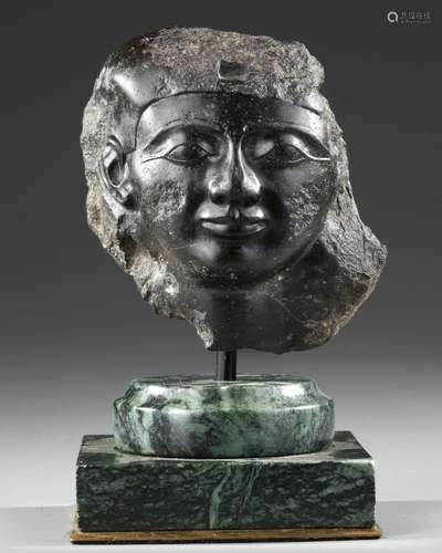 AN EGYPTIAN BLACK BASALT FRAGMENTARY HEAD OF A MALE, PTOLEMA...