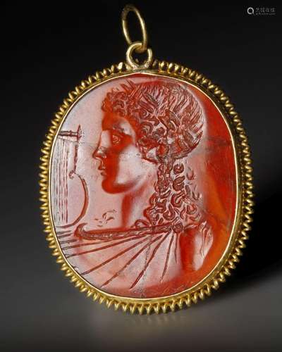 A ROMAN CARNELIAN INTAGLIO WITH THE BUST OF APOLLO, CIRCA 1S...