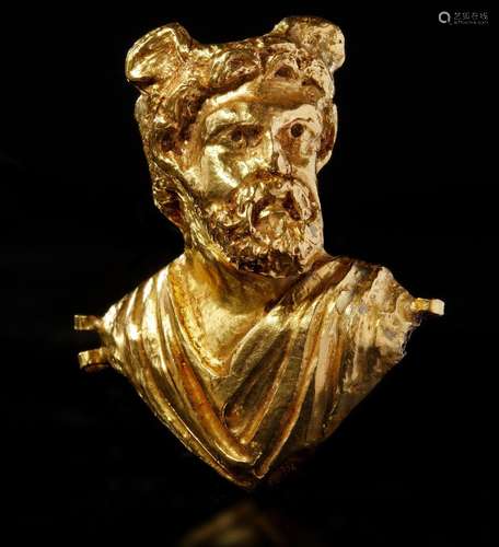 A ROMAN REPOUSSÉ GOLD BUST OF A MAN WITH WINGED HEAD, CIRCA ...