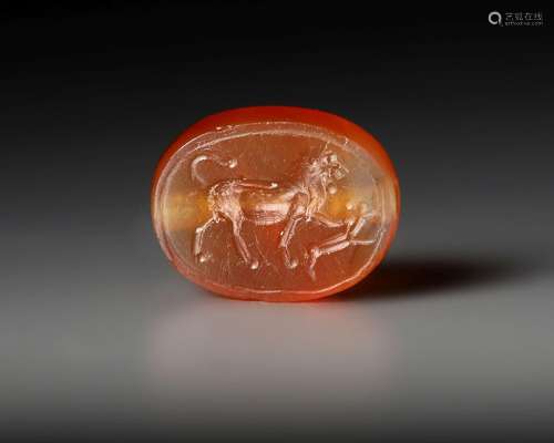 AN EASTERN GREEK CARNELIAN SCARABOID SEAL WITH LION, CIRCA 5...