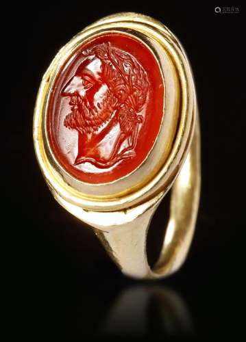 A ROMAN CARNELIAN INTAGLIO WITH GOLD RING, CIRCA 2ND-3RD CEN...