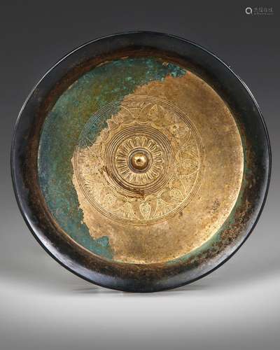 AN ACHAEMENID BRONZE LOTUS PHIALE, CIRCA 6TH-5TH CENTURY B.C...