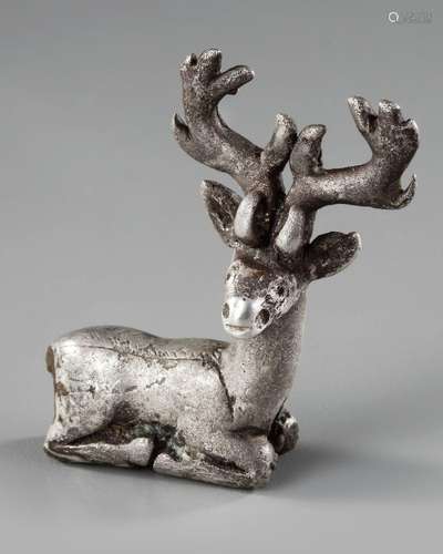 AN ELAMITE SILVER RECLINING STAG, CIRCA 2ND CENTURY B.C.