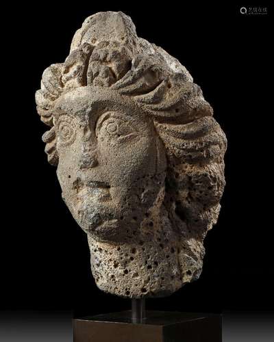 A ROMAN BASALT HEAD OF A WOMAN "HAURAN", CIRCA 2ND...